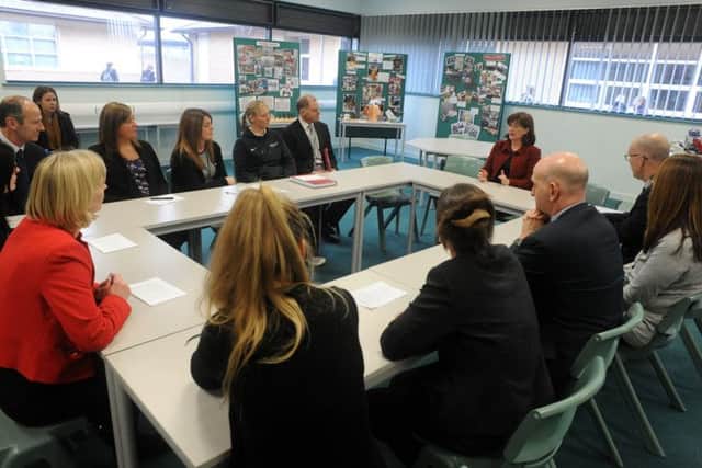 Education Secretary, Nicky Morgan, pictured with head teacher, Alan Senior and staff members during her visit to the Netherthorpe School in Staveley on Thursday.