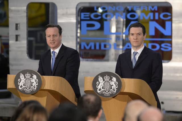 Prime Minister David Cameron (left) and Chancellor George Osborne (right) address workers at the Bombardier Transportation site in Derby, where Mr Osborne announced £5.2 billion investment in road and rail projects in the Midlands as part of a plan he said could create 300,000 new jobs in the region by 2020. PRESS ASSOCIATION Photo. Picture date: Thursday February 12, 2015. Improvements could include the electrification of rail lines linking Birmingham to Bristol and Derby, as well as the widening of sections of the M1 and M5 motorways. See PA story POLITICS Midlands. Photo credit should read: Joe Giddens/PA Wire