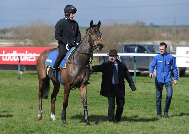 THE FAVOURITE -- champion jockey Tony McCoy on Shutthefrontdoor after a pre-Grand National workout at Southwell a couple of weeks ago (PHOTO BY: Anna Gowthorpe/PA Wire).