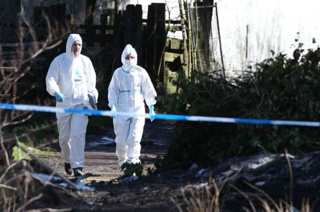 Police forensic investigators at High Craigton Farm on the north-western outskirts of Glasgow, where human remains were found last night by police investigating the disappearance of student Karen Buckley. Andrew Milligan/PA Wire