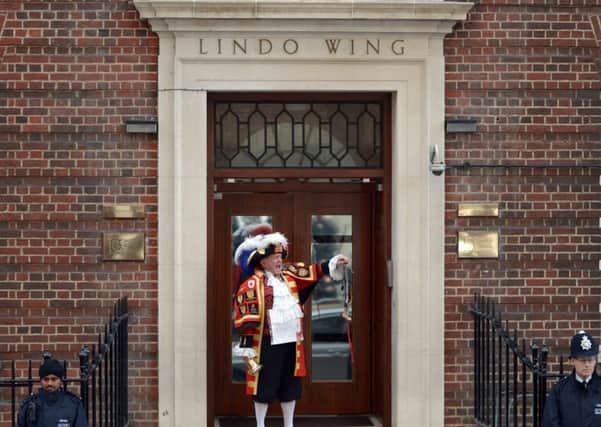 Town crier Tony Appleton proclaims the birth of the second child to the Duke and Duchess of Cambridge, outside the Lindo Wing of St Mary's Hospital in Paddington, west London. PRESS ASSOCIATION Photo. Picture date: Saturday May 2, 2015. See PA story ROYAL Baby. Photo credit should read: Anthony Devlin/PA Wire