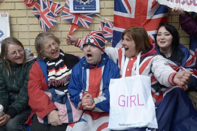 Well wishers celebrates the announcement of the birth of the second child to the Duke and Duchess of Cambridge, outside the Lindo Wing of St Mary's hospital as the Duchess of Cambridge has been admitted after going into labour this morning, London. PRESS ASSOCIATION Photo. Picture date: Saturday May 2, 2015. See PA story ROYAL Baby. Photo credit should read: Anthony Devlin/PA Wire