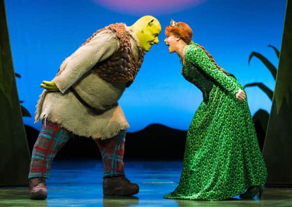 Dean Chisnall (Shrek) and Faye Brookes (Princess Fiona). in Shrek the Musical.