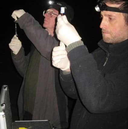 Vaccinators Fred Dyson and Mike Byrant preparing vaccines. Photo: BEVS Vaccinations/Derbyshire Wildlife Trust.