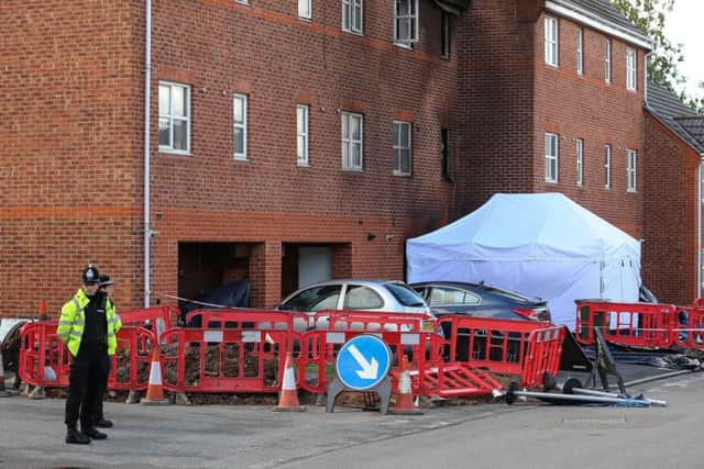 The scene on North Street, Langley Mill, Derbyshire today June 22 2015. A forensics tent covers a car outside the fire damaged flats. A fire tragically took the lives of three people when it broke out over the weekend. Locals said the three who died were six-month-old Ruby Gaunt, her 17-year-old mother Amy Smith and friend Ed Green. Rubyâ¬"s father Shaun Gaunt was rescued. Derbyshire police have said the fire is being treated as unexplained at this stage. 

Tom Maddick / Rossparry.co.uk
