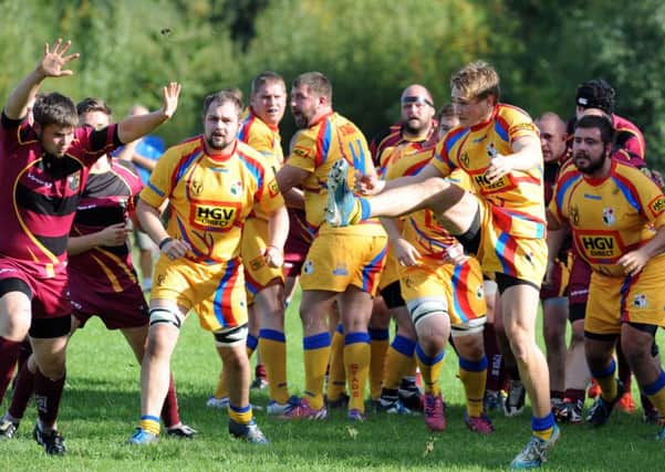 Amber Valley RUFC (Maroon), v Buxton.     
Buxton's Greg Mellor in the thick of it.