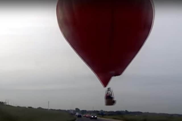 The balloon narrowly missed cars