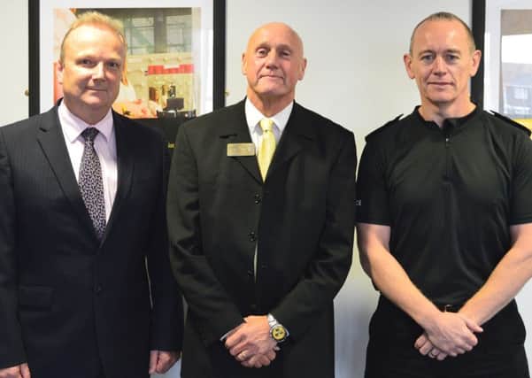 Stockport College Principle Simon Andrews, police volunteer Len Howarth and Section Inspector Barry Doyle