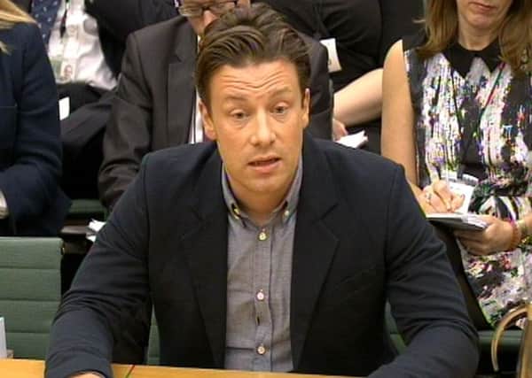 Celebrity chef Jamie Oliver answers questions in front of the Health Select Committee at the House of Commons, London in the subject of Child Obesity Pic:  PA Wire