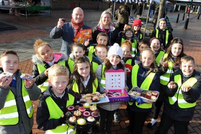 Pupils at Barrow Hill Primary School made cakes to hand out to people in Staveley to put smiles on their faces after the Paris terror attacks.