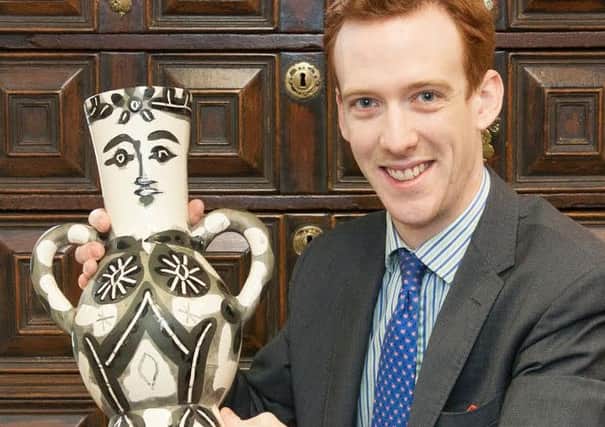 Decorative Arts valuer John Keightley from Hanson's auctioneers with the Picasso vase
