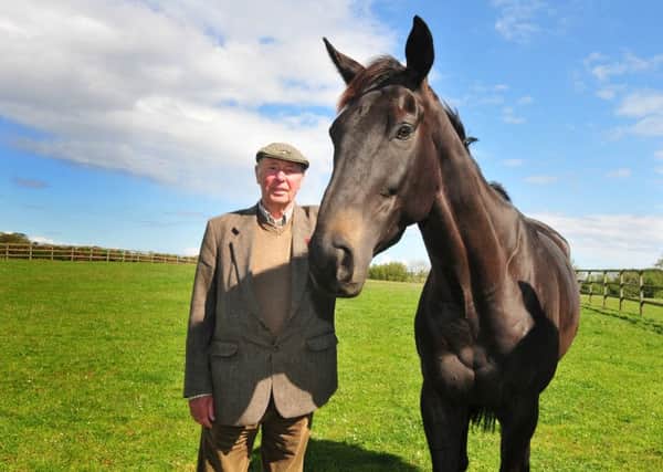 TEA FOR TWO? -- owner Trevor Hemmings with this years Crabbies Grand National winner, Many Clouds. They must defend their Aintree titles at tea-time in 2016.