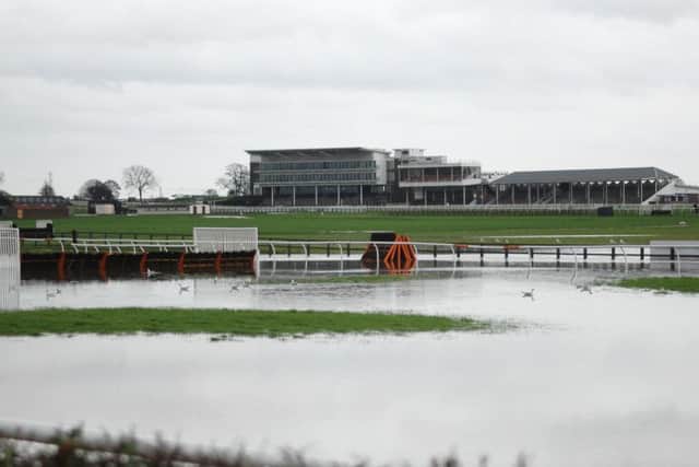 RAIN STOPPED PLAY -- a far cry from Cue Card's heroic victory in the King George at Kempton on Boxing Day was this scene at Wetherby where flooding sank the track's big Christmas meeting.