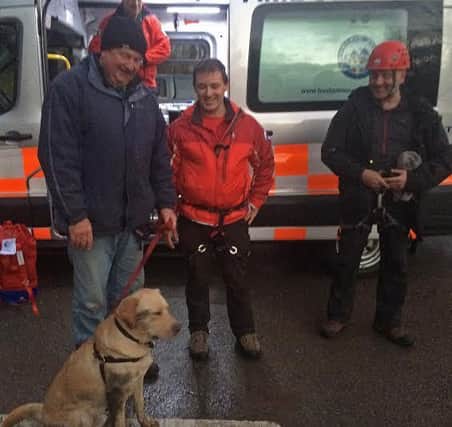 Buxton Mountain Rescue Team crews with Archie after they saved him. Picture submitted.