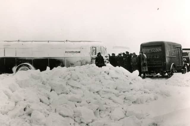 Buxton Advertiser archive, 1947, German POWs digging out abandoned vehicles at Tom Thorn on the A6 outside Buxton