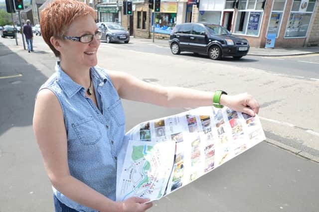 Lyn Bannister with the guide to the New Mills Art Trail