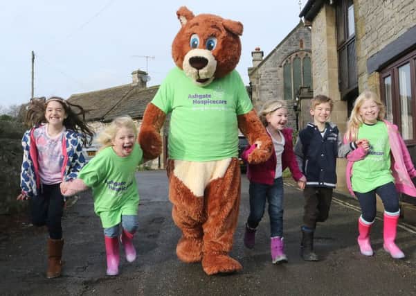 Ruby and Kitty Pearce with friends Arabella Clarke and Annabel and Edward Maynard and hospice mascot Ashley the Bear