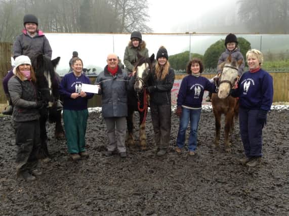 The Helen Atkin Riding for the Disabled Association Group has received a donation of Â£500 from the High Peak Lodge of Freemasons in Buxton. Pic provided by Philip Warhurst