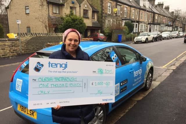 Sheffield 1,000 Tengi winner Olesia Tartakovski with her 1,000 giant sized cheque