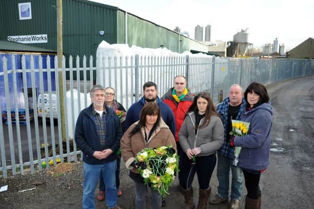 Kathryn Pallier, front with wreath, with family and friends from left, Paul Ennion, Hilda Palmer, Dan Pallier-Singleton, Clyde Walker, Sophie Pallier-Singleton, Mark Sands and Sue Pallier.