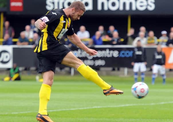 Date:31st August 2013.
Harrogate Town v Stockport County. Pictured Harrogate Town's Ashley Worsfold, firers a shot towards the stockport County's goal, but fails to score on this attempt.