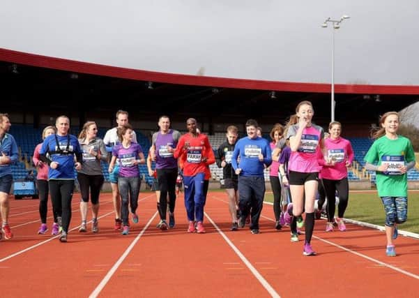 Mia Swindell, in green, and mum Dawn got the chance to meet Mo Farah