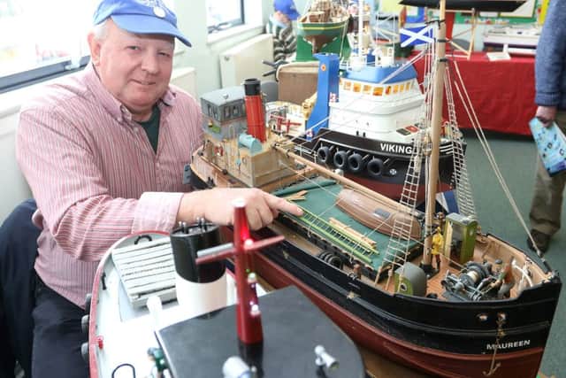 NMDRM annual show, Keith Holmes commodore of the Buxton Model Boat Club with his model of a Clyde Puffer