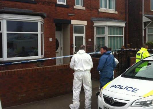 Police launched a double murder investigation following the discovery of the dead bodies of Julie Hill and Rose Hill at Julie Hill's house, pictured left, on Station Road, Shirebrook.