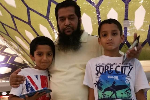 Tengi 10,000 winner Anwar Hussain with his boys Ali and Asif