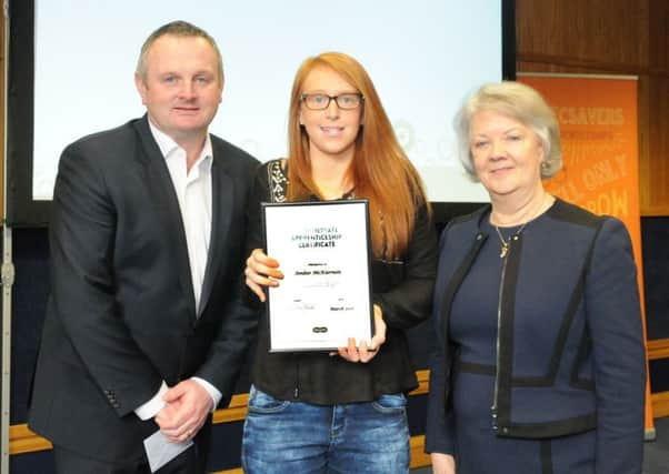 Specsavers Buxton apprentice Amber McKiernon with joint UK managing director Dame Mary Perkins and Paul Marshall.