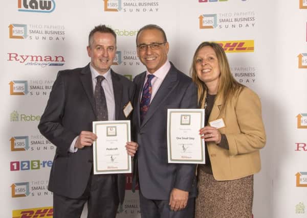 Nicola Sargeant and Mark Sidebottom receive their certificates from former Dragon Theo Paphitis. Photo contributed.