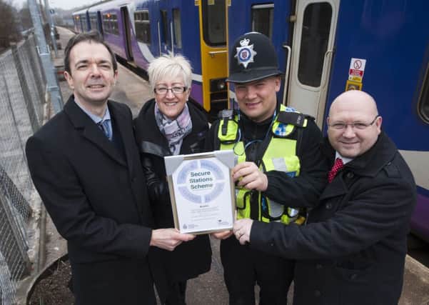 Andrew Walker of High Peak and Hope Valley Community Rail Partnership with Julie Corke of Northern Rail, PC Chris O'Connor and Dean Collins of Derbyshire County Council.