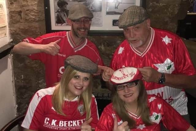 Reds' fans Jason Mower, Martin Colman, Rachel Smailes and Lyndsey Smith proudly wearing their flat caps