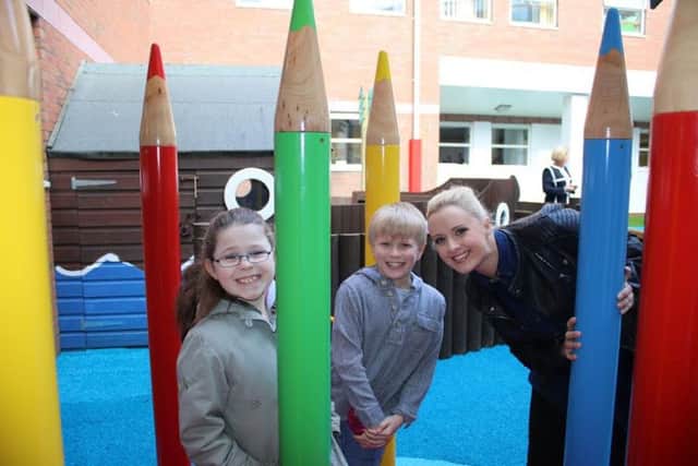A new play area for young patients at Stepping Hill Hospital has opened, thanks to a generous Â£33,249 donation from charity MedEquip4Kids; pictured are Stockport NHS Trust chairman Gillian Easson with CBBC Presenter Katie Thistleton, staff, representatives from MedEquip and Vinci, children and families.