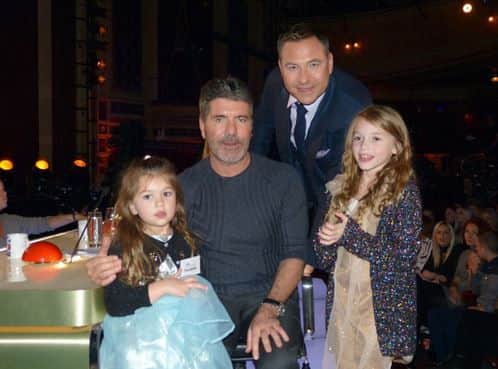 Nine-year-old Alicia Day, right, sang to Simon Cowell. Pictured with her sister and other judge David Walliams.