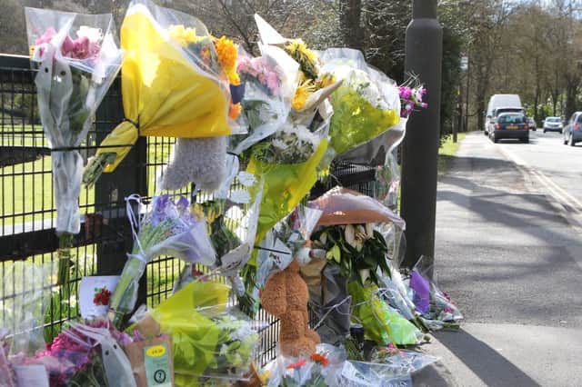 Flowers left in memory of Carl Buxton.