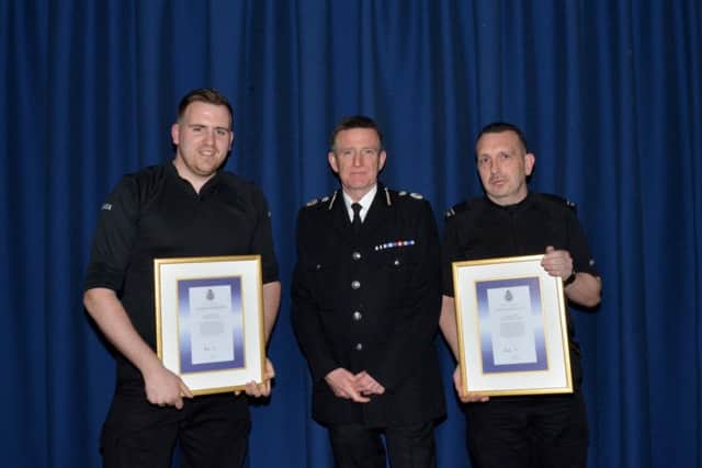Constables Martyn Woodward and Ashley Sayer receive their awards at The Derbyshire Constabulary Celebrating Achievement Awards.
