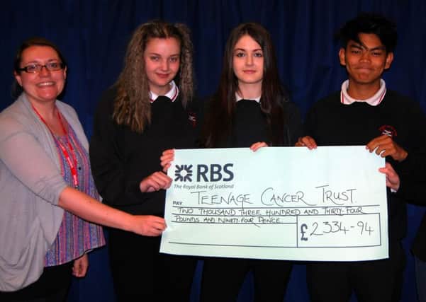 Chapel en le Frith High School present cheque to Teenage Cancer Trust charity.