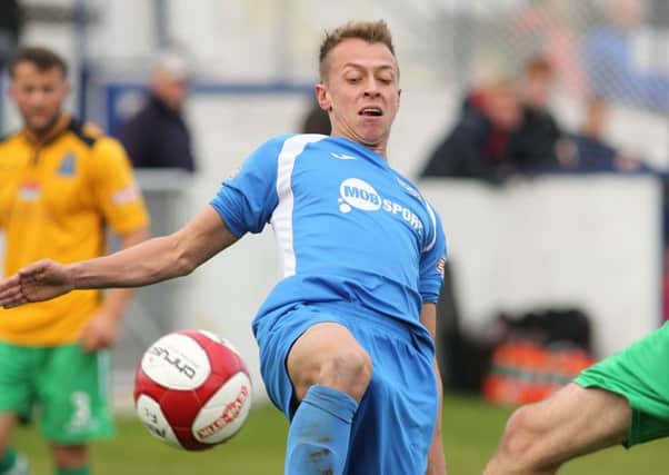 Brad Grayson, pictured in action for Frickley, has played his football in England, Australia, Sweden and the Philippines.