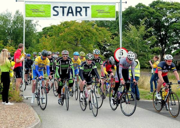 Cyclists pictured at Ashgate Hospice & in the Peak district, as they supported the Hospice in the Flag Cycle Challenge, Chesterfield.NDET 26-7-15 Flagg, Cyclists leaving the start at Ashgate Hospice ( 9 to 14)