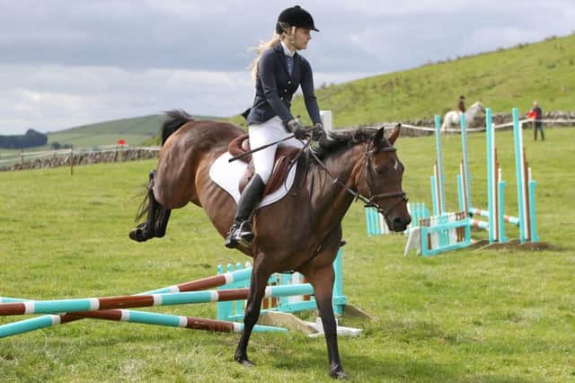 Imogen Green competing in the beginner's jumping competition.