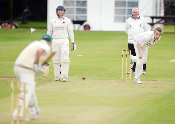 IN THE WICKETS -- Shaun Critchlow, who took three wickets for Dove Holes at Tintwistle.
