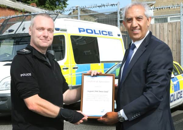 Sgt Trevor Steed is congratulated by Derbyshire PCC Hardyal Dhindsa.