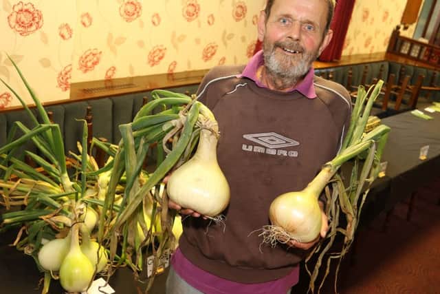Whaley Bridge show, Geoff Longden with a a pair of giant onions