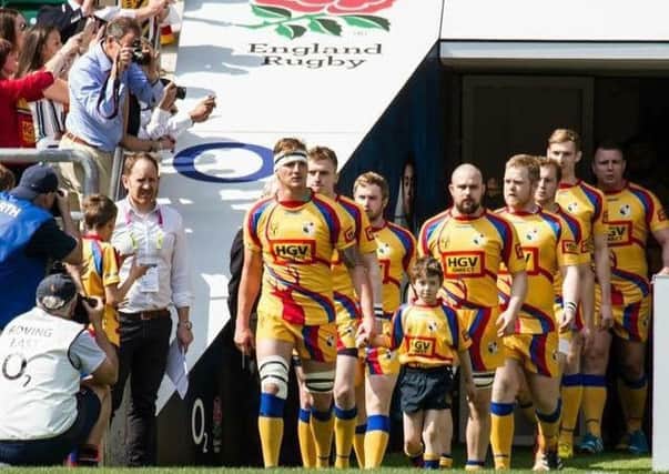 DAY TO REMEMBER -- proud Buxton players walk out at Twickenham for their memorable Junior Vase final at the end of last season.