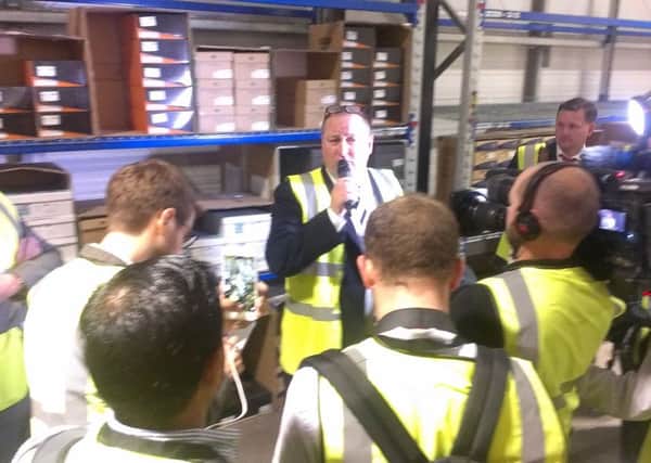 Sports Direct's Mike Ashley talks to the press inside one of his Shirebrook warehouses.