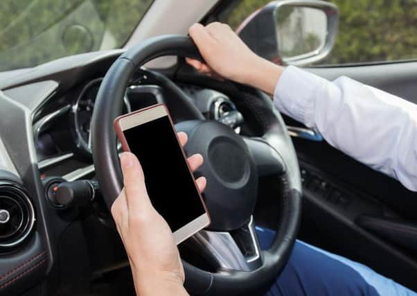 The RAC is calling for an awareness campaign to highlight the dangers of using mobile phones at the wheel.