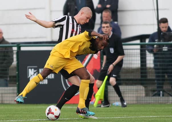Chris Salt (stripes) in action for Clipstone. -Pic by:Richard Parkes