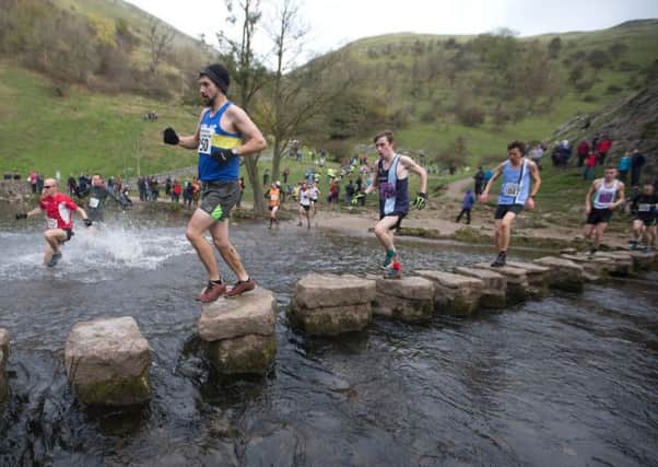 TREADING CAREFULLY -- the famous stepping-stone crossing over the River Dove, which is part of the Dovedale Dash route.