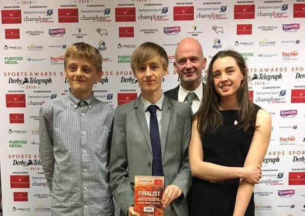 The three medalists from English Fell Championships Finn Moffatt, Alex Ediker and Helen Thornhill having been presented with the finalist award by Jamie Caven.